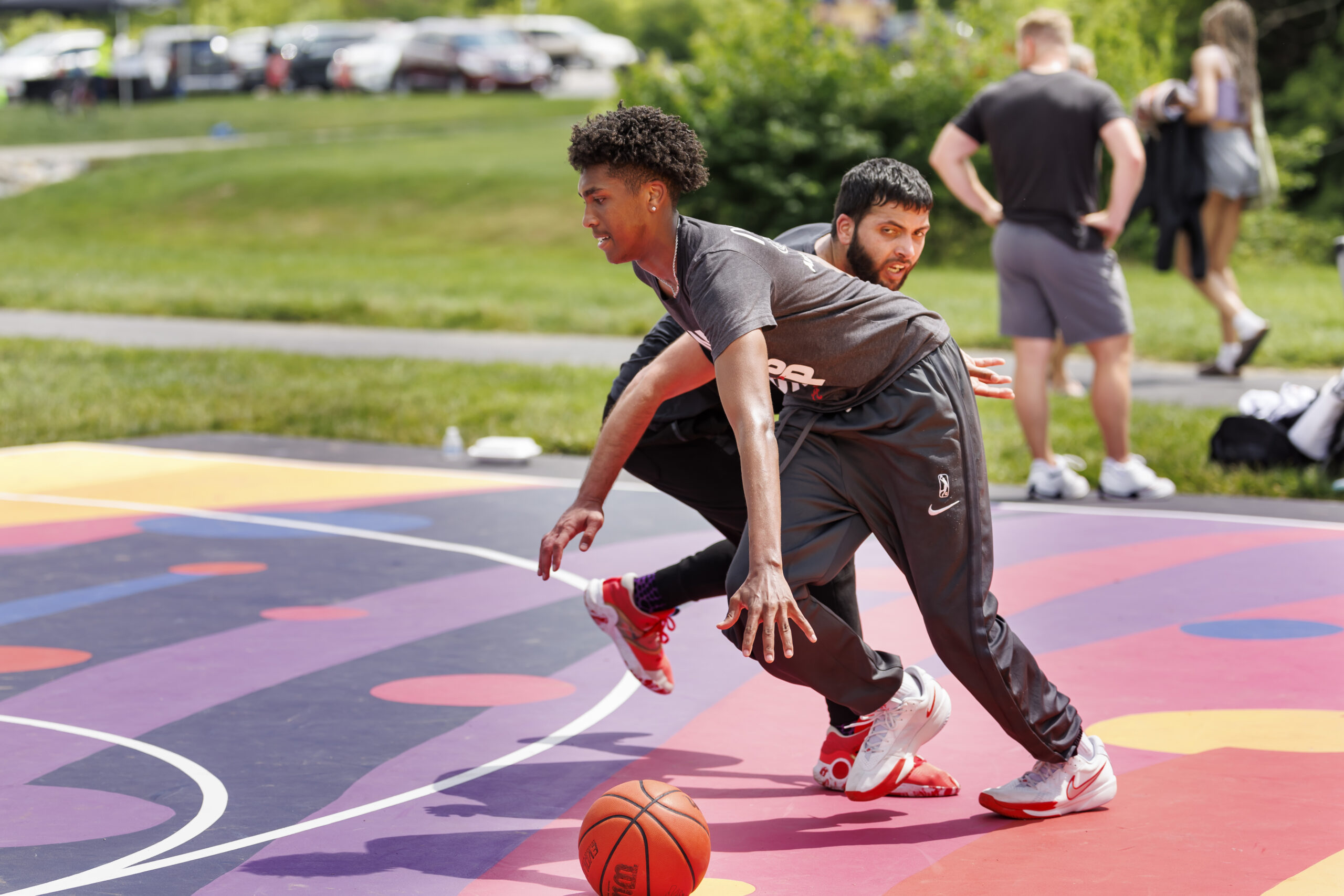 man playing basketball on painted court