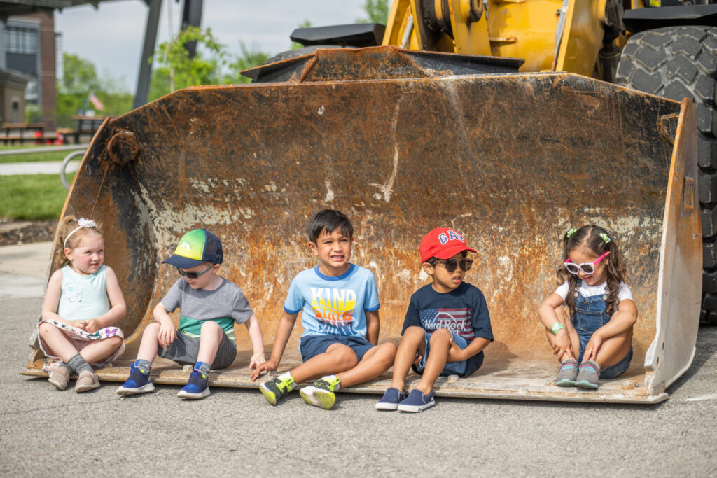 kids sitting on equipment